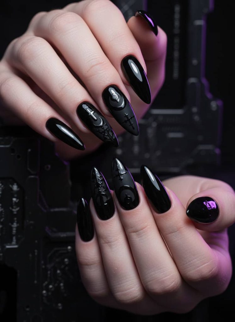 Glossy black stiletto nails with intricate gothic designs like crosses and crescent moons, set against a moody, purple-lit background for a dramatic, edgy aesthetic.